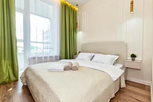 Postel nebo postele na pokoji v ubytování Шикарные апартаменты в Астане