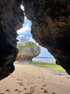 a view of the beach from a cave at DaigeBlue - Vacation STAY 20513v in Meta