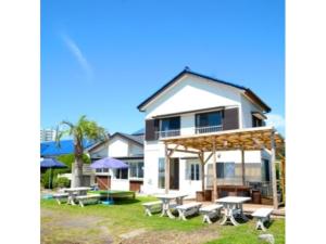 a house with picnic tables in front of it at Orizon - Vacation STAY 21713v in Minamiboso