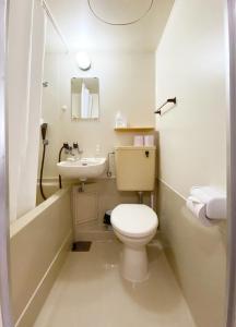 a small bathroom with a toilet and a sink at Flat piece chair house - Vacation STAY 40366v in Fuzuchi