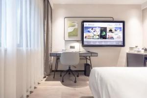 Ένα ή περισσότερα κρεβάτια σε δωμάτιο στο Atour X Hotel Nanjing Mochao Lake Shuiximen Street