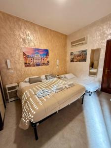 a bedroom with a large bed in a room at Appio Rooms Haven in Rome +29 photos