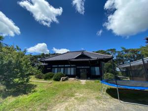 a house with a playground in front of it at Haru no Sato - Vacation STAY 10683 in Kido