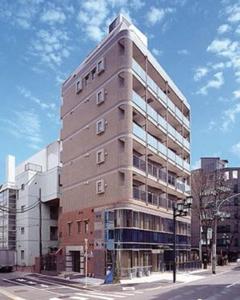 a tall building on the corner of a street at Marvelous Kokubunji - Vacation STAY 80468v in Kokubunji