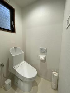 a white bathroom with a toilet and a window at Wonderful stay TOKYO - Vacation STAY 30862v in Tokyo
