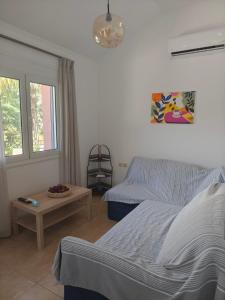 a living room with a couch and a table at Rias Efthimiou House in Kanallaki