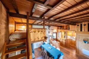 a bedroom with a bunk bed in a log cabin at L'Escampette à la Fontanette in Saint-Pancrace