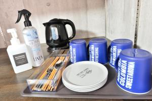 a tray with cups and plates and a coffee maker at STEP by STEP - Vacation STAY 25751v in Kanayama +24 photos