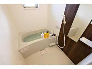 a bathroom with a shower with a sink at Ocean Terrace Sesoko 101 - Vacation STAY 28609v in Ufugumui +40 photos
