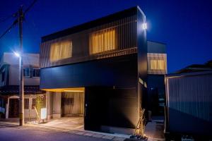 a black building with two lights on top of it at Oyado Kai - Vacation STAY 35285v in Sasebo