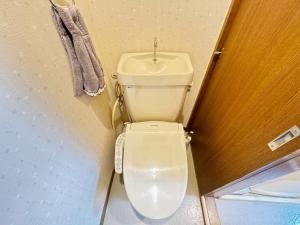 a bathroom with a white toilet in a room at La Mer Urayasu - Vacation STAY 11148 in Urayasu +26 photos