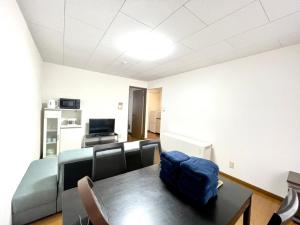 a living room with a couch and a table at Avidasion - Vacation STAY 13342 in Biei