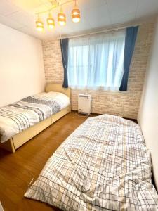 Postel nebo postele na pokoji v ubytování Avidasion - Vacation STAY 11971