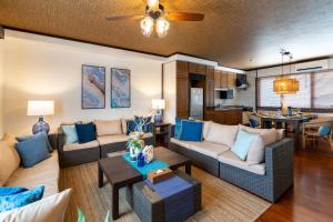 a living room with couches and a dining room at ISHIGAKI HOUSE - Vacation STAY 32172v in Ishigaki Island