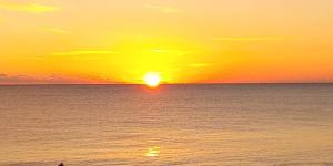 a sunset over the ocean with the sun setting at Guest House Fukuchan - Vacation STAY 83847v in Kaiyo