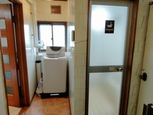 a bathroom with a sink and a toilet in a room at Bay View House - Vacation STAY 17471 in Otaru +8 photos