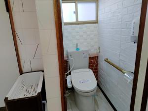 a small bathroom with a toilet and a window at Bay View House - Vacation STAY 17471 in Otaru