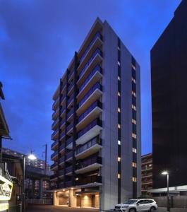a building with a car parked in front of it at A,T,HOTEL HAKATA - Vacation STAY 36414v in Fukuoka