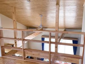 a room with a wooden ceiling and a window at Yonehara Beach Stay LUANA - Vacation STAY 38711v in Fukai +53 photos