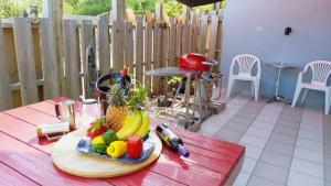 a plate of fruits and vegetables on a table at Hotel Yua - Vacation STAY 40741v in Nago