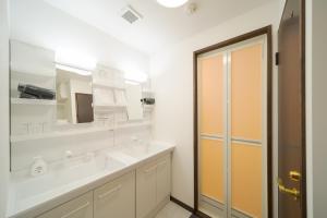 a bathroom with a sink and a mirror at Tabi no yado Hanakeshiki Nadeshiko 3rd floor - Vacation STAY 42987v in Yufuin +33 photos
