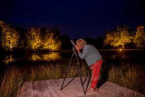a young boy looking into a camera in a tripod at Les Hayes en Sologne - Proche Chambord in Fontaines-en-Sologne