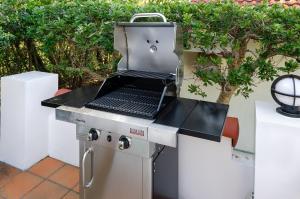 a grill with a laptop sitting on top of it at Bay Coast Villa Goishigahama - Vacation STAY 45736v in Shimoda