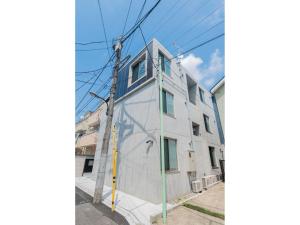 an apartment building with a mural on the side of it at bmj Hyakunincho - Vacation STAY 46879v in Tokyo