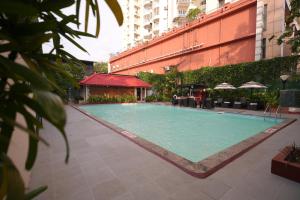 a large swimming pool in the middle of a building at Vivanta Ernakulam, Marine Drive in Cochin