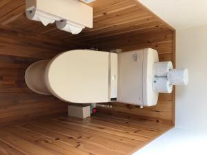 a white toilet in a room with wooden walls at YADO Kukkal- Vacation STAY 48433v in Amami +13 photos