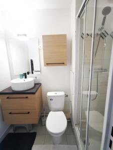 a bathroom with a toilet and a sink and a shower at Studio Ciel d'Azur - 4 pers - Fréjus Plage - Tout à pied in Fréjus