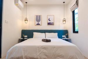 Ένα ή περισσότερα κρεβάτια σε δωμάτιο στο Lotus Enzio unit 16 - 2 Bedrooms Canggu