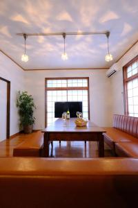 a living room with a table and a couch at iORi Yufuin - Vacation STAY 42351v in Yufuin