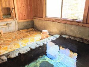 a large pool of water in a room with a fire hydrant at iORi Yufuin - Vacation STAY 42351v in Yufuin +8 photos