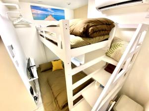 a room with two bunk beds and a bed at Le Soleil Asato - Vacation STAY 48649v in Naha