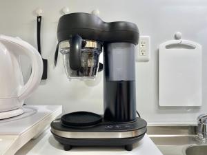a black blender sitting on a kitchen counter at Le Soleil Asato - Vacation STAY 48667v in Naha