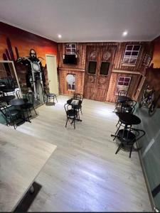a room with chairs and a painting on the wall at Hotel Santiago Yungay in Santiago +14 photos