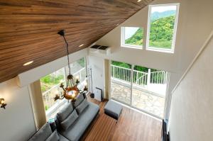 an overhead view of a living room with a couch and windows at Bay Coast Villa Susaki - Vacation STAY 45723v in Shimoda
