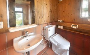 a bathroom with a white toilet and a sink at Bay Coast Villa Kisami - Vacation STAY 33529v in Shimoda