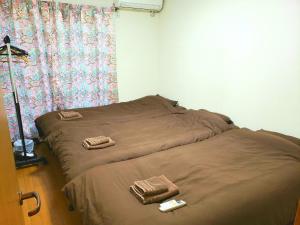 Giường trong phòng chung tại Within walking distance of Disneyland! - Vacation STAY 11473 +55 ảnh