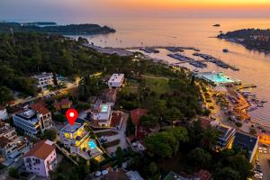 an aerial view of a city with a red marker at Villa Albion in Rovinj
