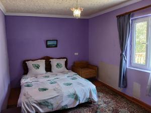 Llit o llits en una habitació de Rossi Rest House