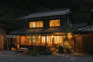 a house lit up at night with lights at Hotaru no Yado - Vacation STAY 68063v in Fukuyama