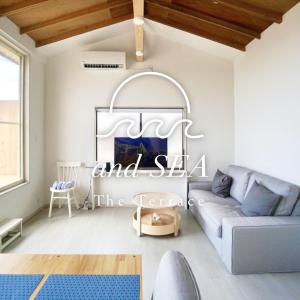 a living room with a couch and a table at and SEA The Terrace - Vacation STAY 72600v in Kamogawa