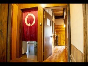 an open door to a hallway with a red curtain at Cafe Restaurant Umi no Yado Awaji Island - Vacation STAY 61253v in Awaji +2 photos