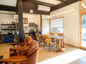 a living room with a table and chairs at Takayanagi Ryokan - Vacation STAY 88528v in Takamatsu