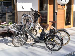 two bikes parked next to each other in front of a building at Takayanagi Ryokan - Vacation STAY 88528v in Takamatsu +46 photos