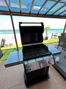 a barbecue grill with a view of the beach at BreezyBlue - Vacation STAY 64820v in Awaji