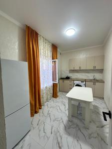 Η κουζίνα ή μικρή κουζίνα στο Уютный дом