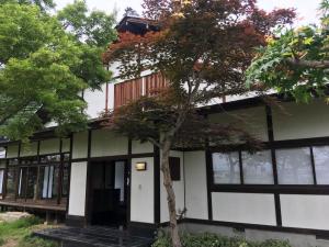 a building with a tree in front of it at Fukurou no Oyado - Vacation STAY 71243v in Fuefuki +9 photos